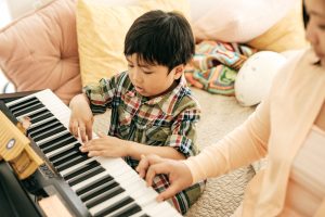 Young Child Playing Piano Stock