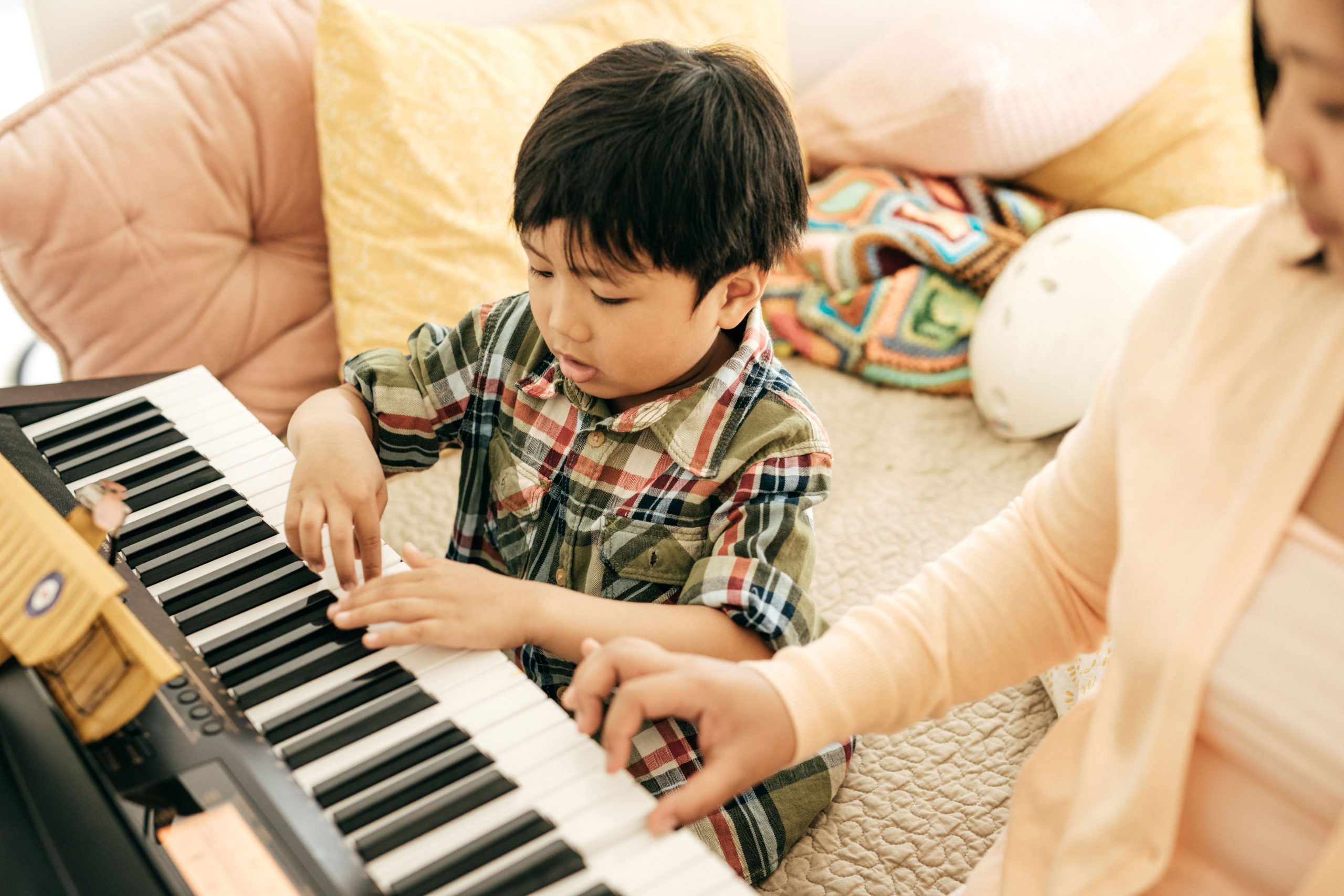 kid playing piano