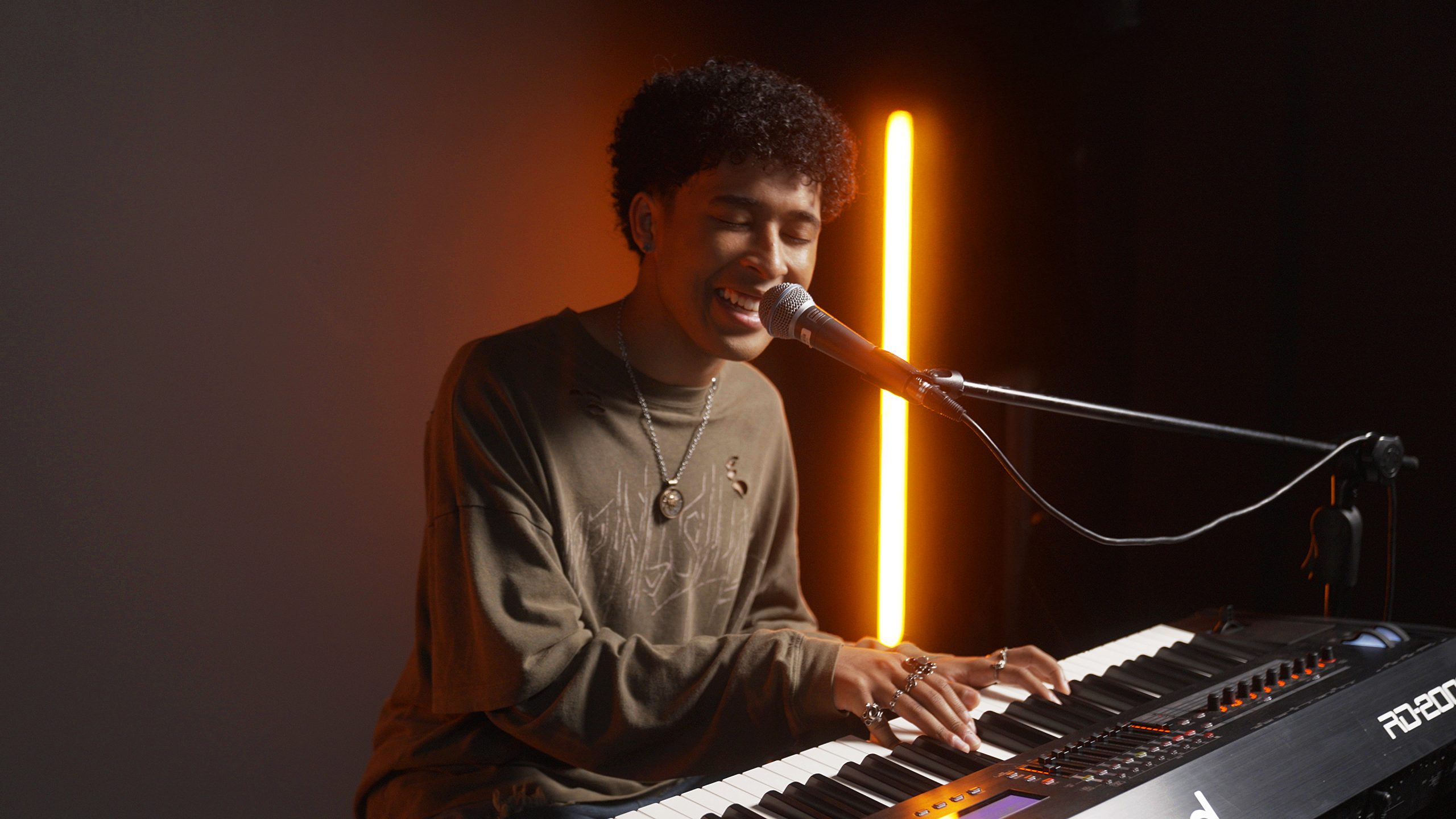 Adrian Lyles performs on a Roland RD-2000 stage piano.