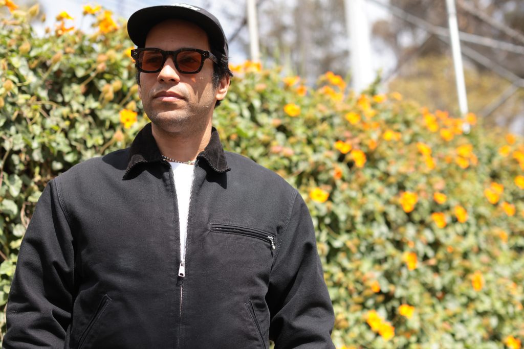 Pachyman in front of flowers