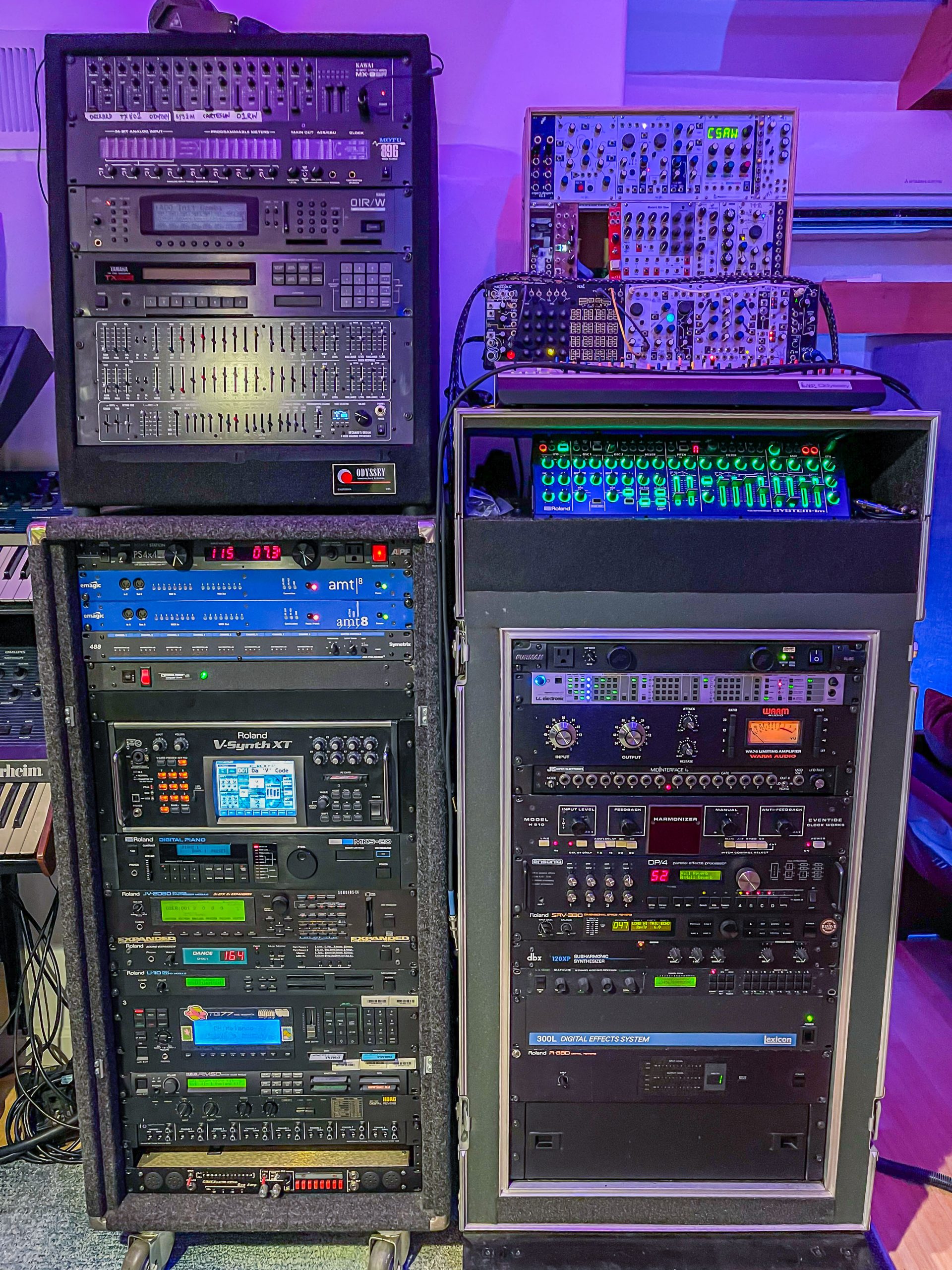 Ryeland Allison's studio synthesizer racks, including the Roland V-Synth XT Synthesizer, MKS-20 Digital Piano, JV-2080 64 Voice Synthesizer Module, MDC-1 Dance Sound Expansion, U-110 PCM Sound Module, SYSTEM -1m PLUG-OUT Synthesizer, SRV-330 Dimensional Space Reverb, and R-880 Digital Reverb