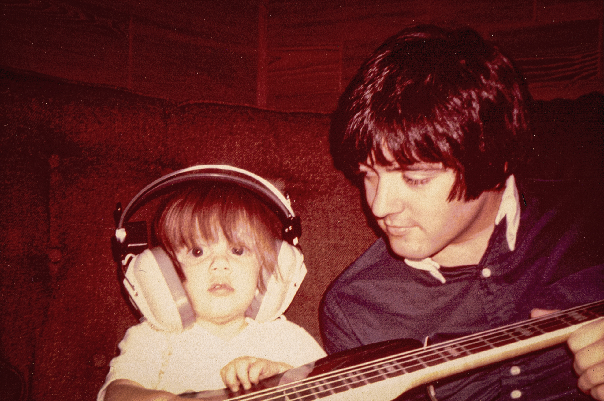 Ryeland Allison (wearing headphones) and his father, Keith Allison